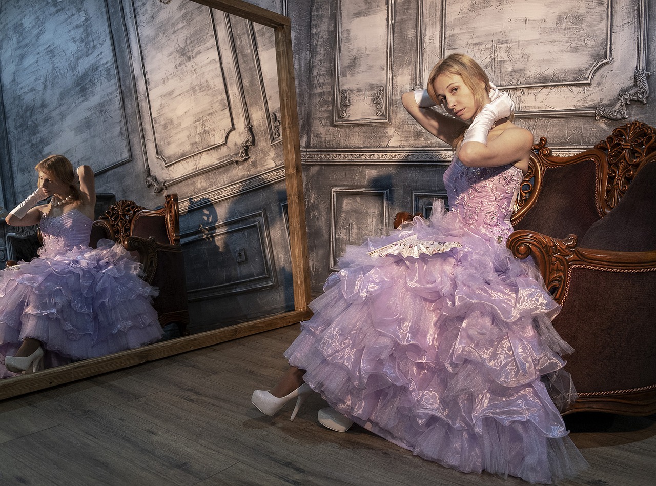 woman in dress in front of mirror