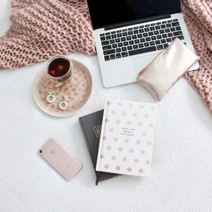 knitted blanket, laptop, tea