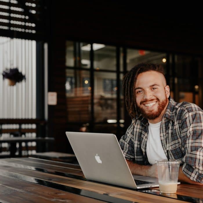 man in cafe with laptop