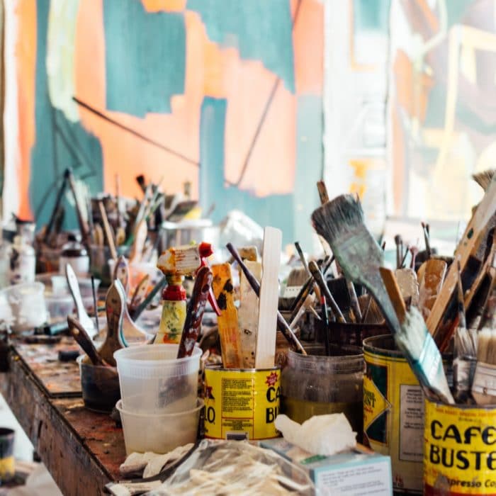 paint brushes in jars