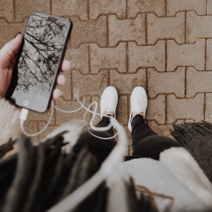 woman listening to music on iphone