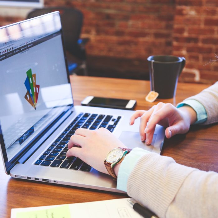 woman making logo on laptop