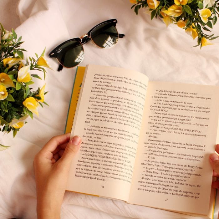 woman reading yellow book