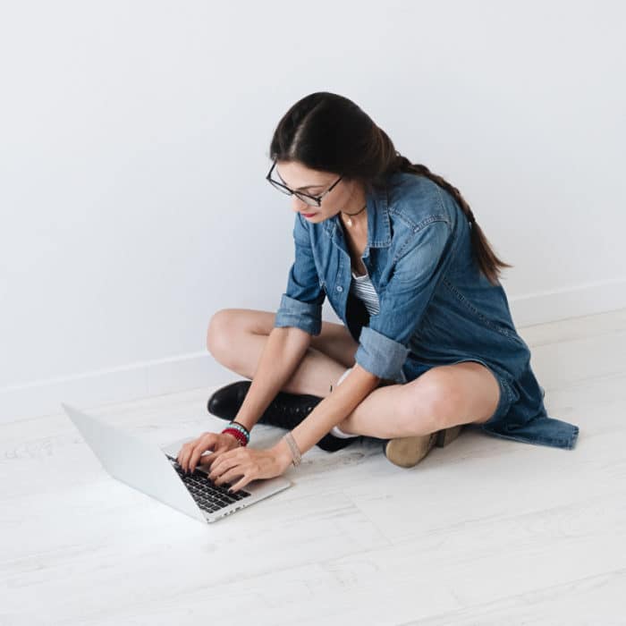 woman working sitting on the ground