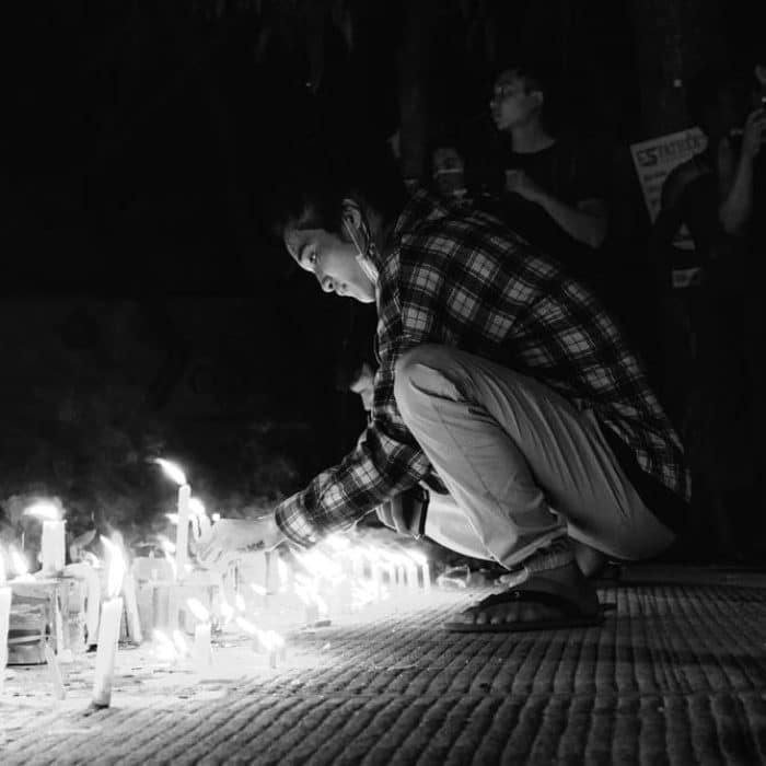 people placing candles