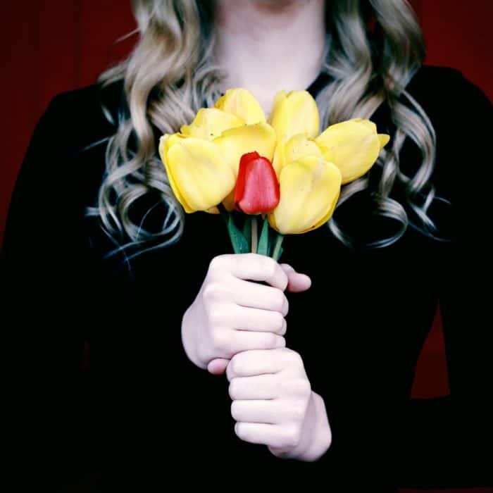 woman holding flowers