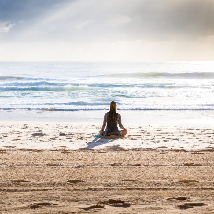 woman sitting on beach