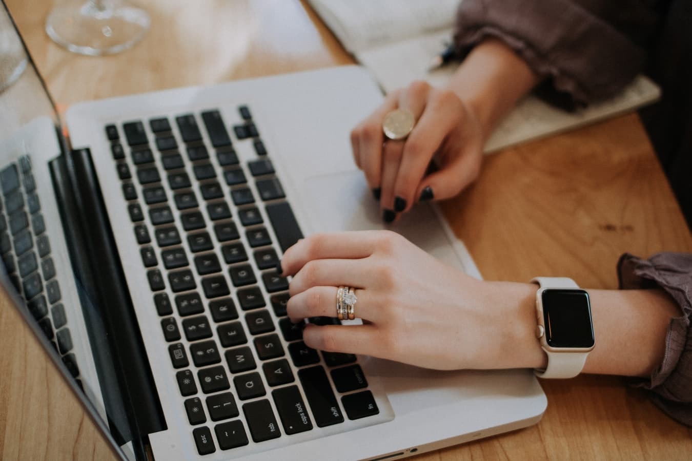 woman with rings typing